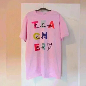 TEACHER pink tshirt with bright letters. Size Medium.